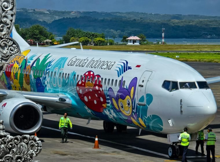 Colourful Garuda Indonesia plane on the tarmac at Bali airport