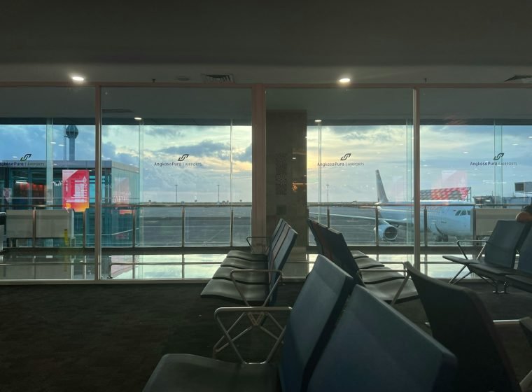 Airport terminal with large windows overlooking the runway