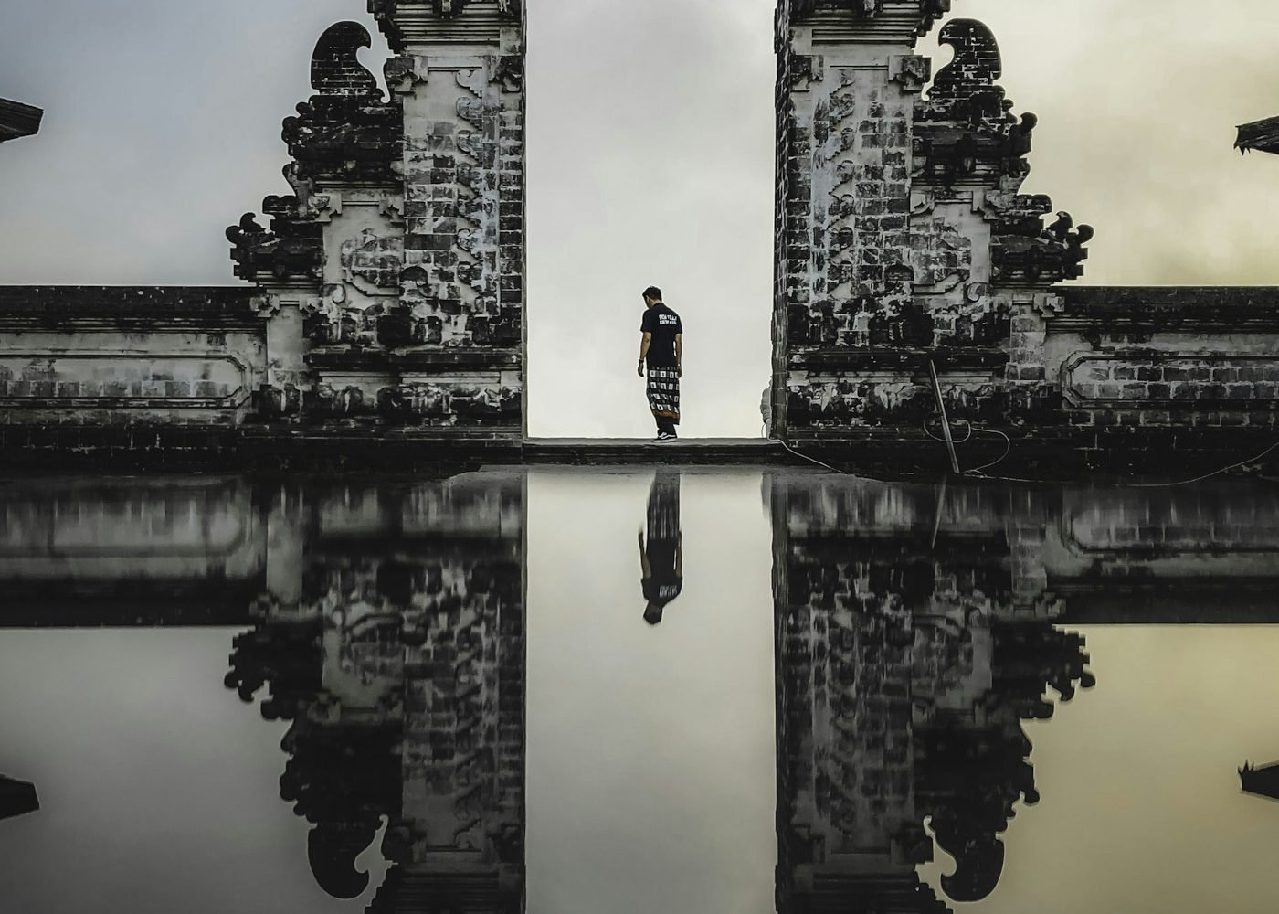 Traveller standing between the split gates of Lempuyang Temple