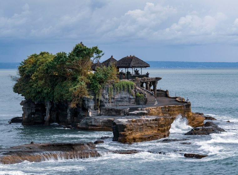 Tanah Lot sea temple on a rock with waves