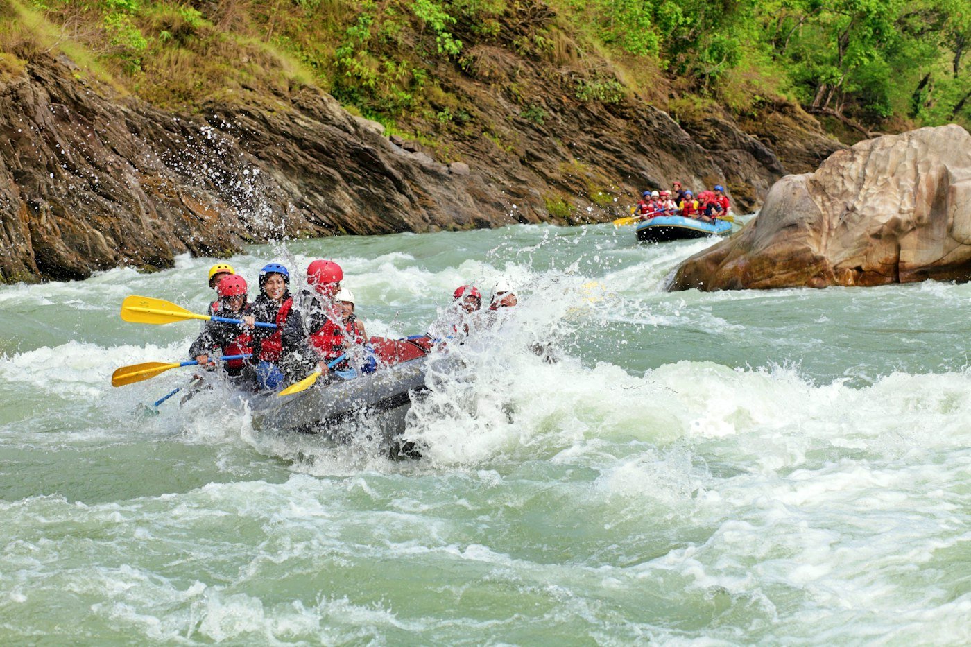 Group white water rafting through rapids on the Ayung River
