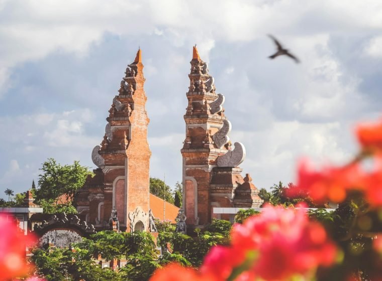 Balinese split gate (candi bentar) with red flowers
