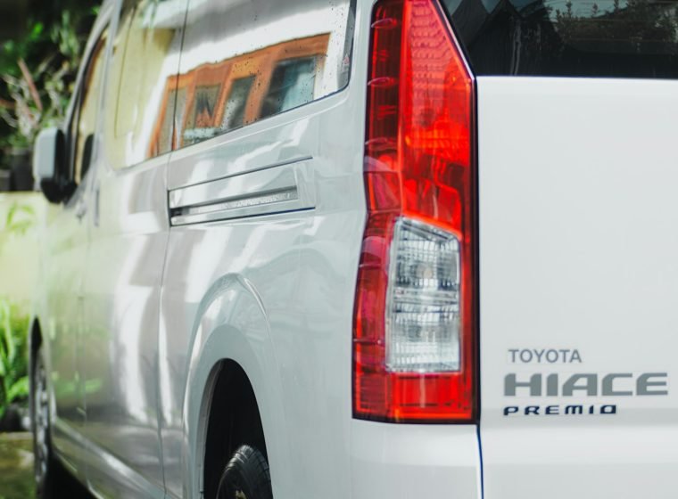 Rear view of a white Toyota Hiace van